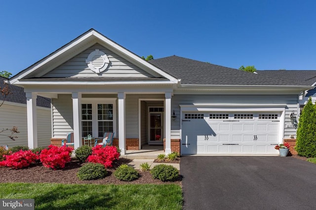 6104 New Berne Rd, Fredericksburg, VA 22407 - view of front of house featuring covered porch, asphalt driveway, a garage, roof with shingles, and brick siding