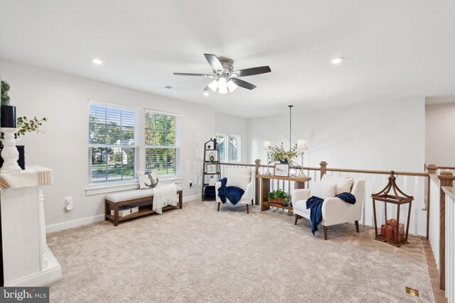 living area with carpet flooring, a chandelier, ceiling fan, baseboards, and recessed lighting