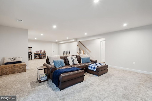 carpeted living room with recessed lighting, stairway, and baseboards