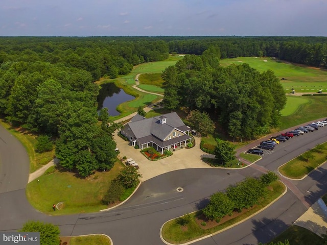 bird's eye view of a nearby body of water, a forest, and a local golf course