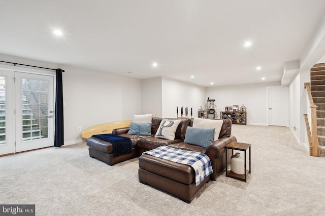 carpeted living room featuring recessed lighting, baseboards, and stairway