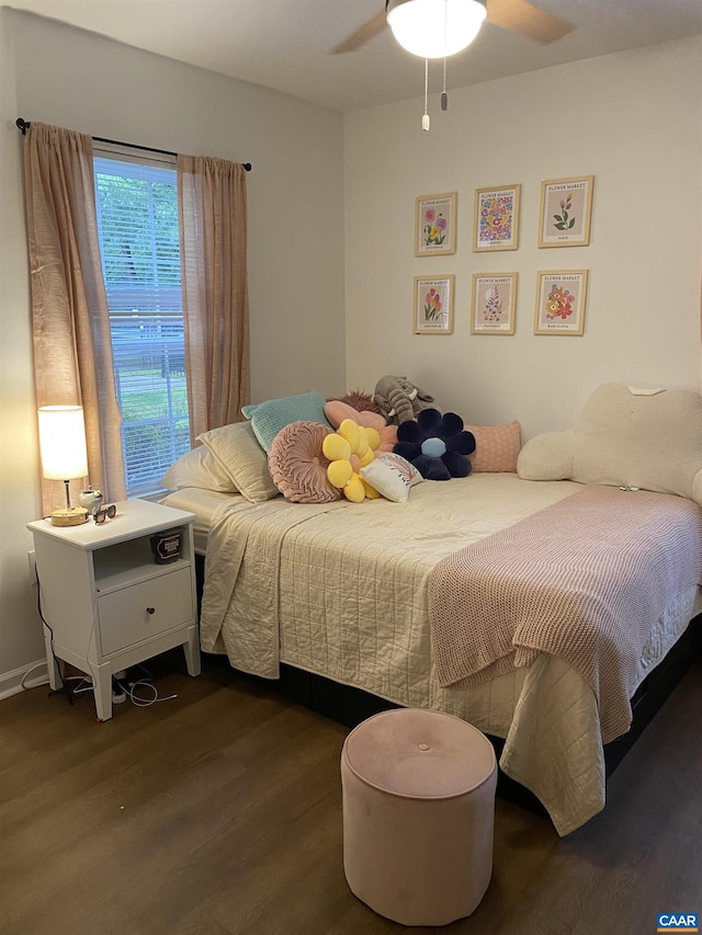 bedroom featuring dark wood-style floors and a ceiling fan