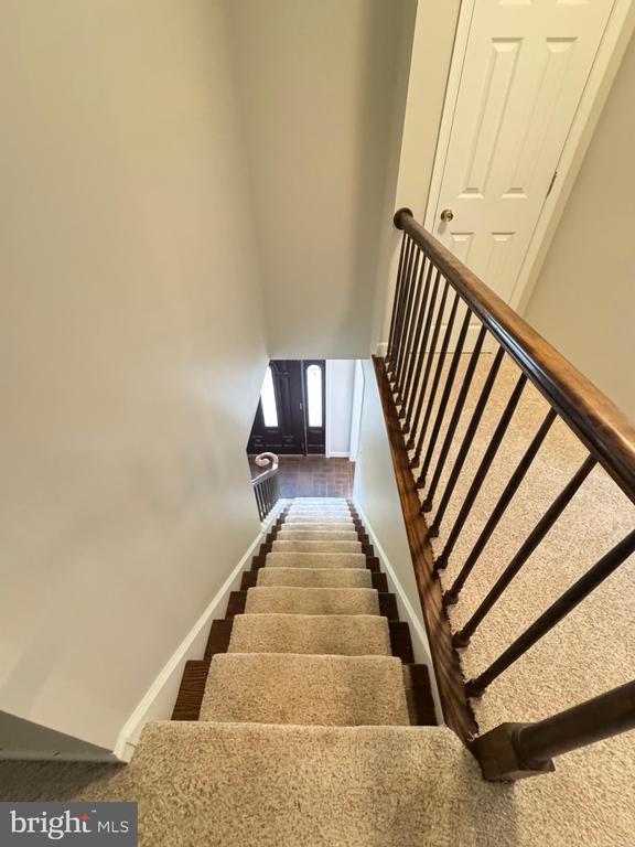 7880 Sir Topas Dr, Warrenton, VA 20186 - stairs with baseboards and a towering ceiling