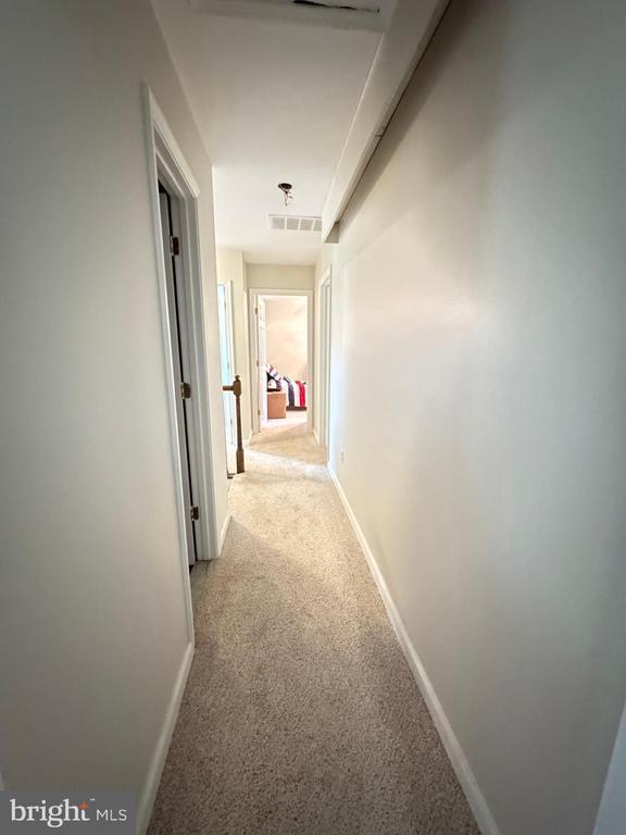 7880 Sir Topas Dr, Warrenton, VA 20186 - hallway featuring carpet floors and baseboards