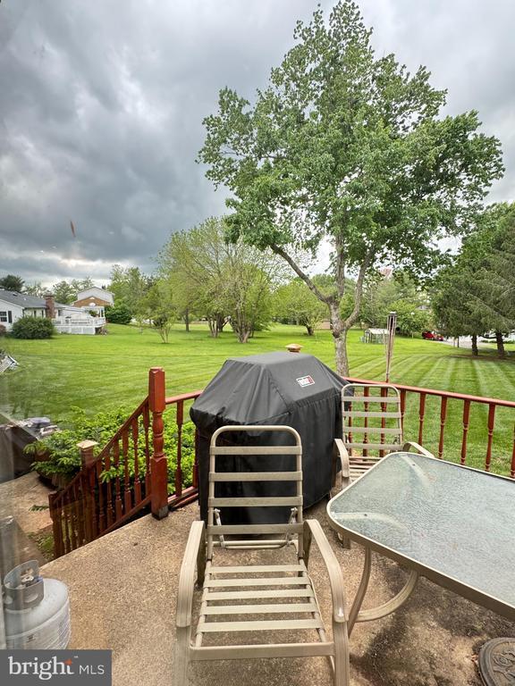 7880 Sir Topas Dr, Warrenton, VA 20186 - wooden terrace featuring a lawn and grilling area
