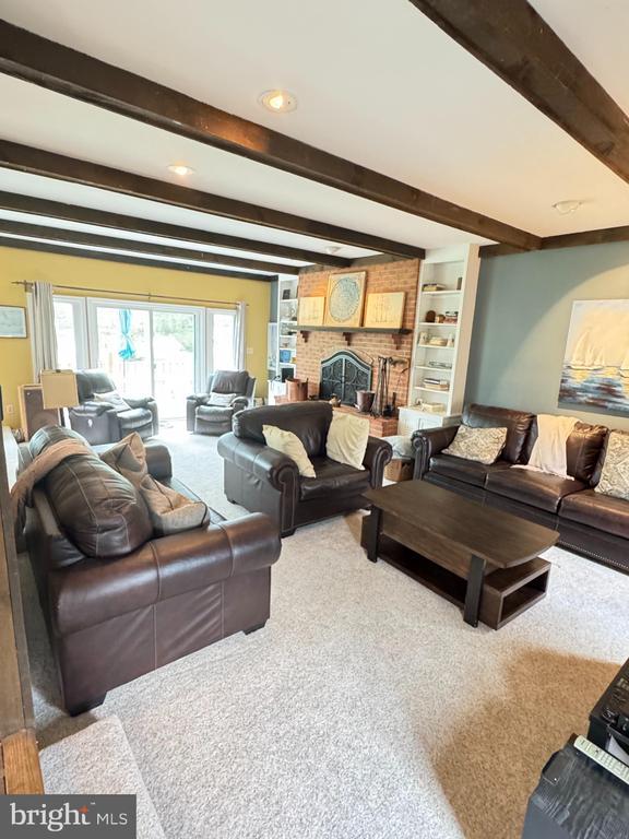 7880 Sir Topas Dr, Warrenton, VA 20186 - living area with carpet, beamed ceiling, and recessed lighting