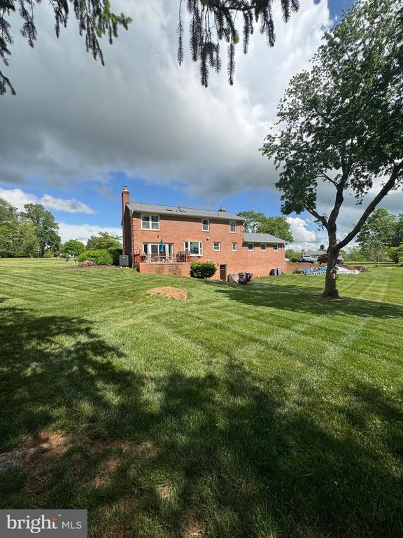 7880 Sir Topas Dr, Warrenton, VA 20186 - rear view of house with a yard and a chimney