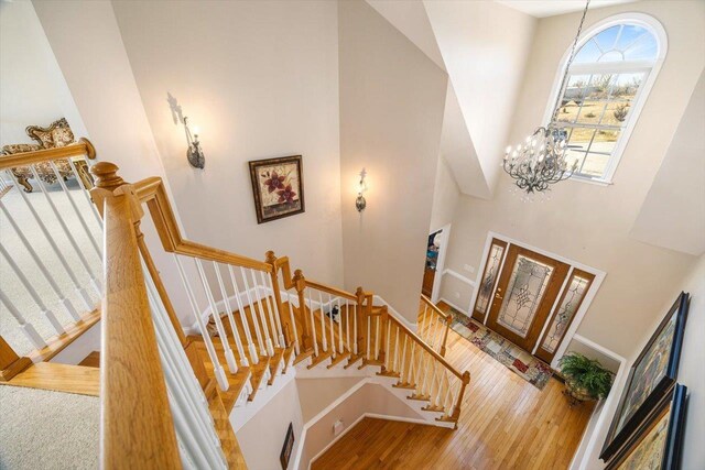 102 Shawn Cir, Staunton, VA 24401 - foyer entrance with wood finished floors, a high ceiling, baseboards, a chandelier, and stairs