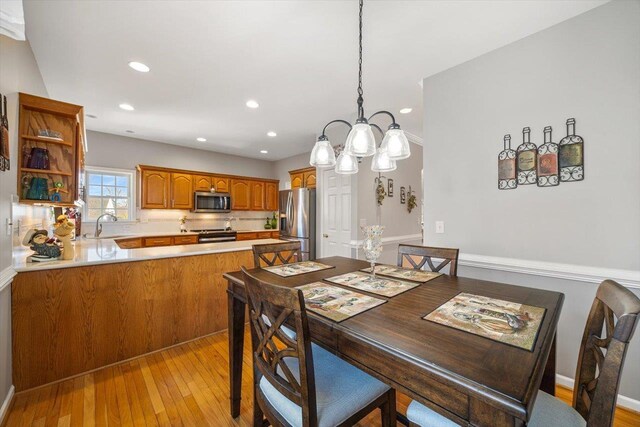 102 Shawn Cir, Staunton, VA 24401 - dining room featuring light wood-style flooring, a notable chandelier, baseboards, and recessed lighting