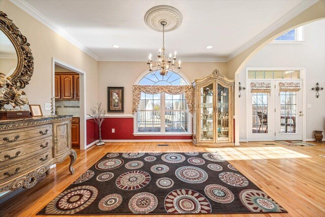 102 Shawn Cir, Staunton, VA 24401 - foyer entrance featuring a wealth of natural light, light wood-style floors, and an inviting chandelier