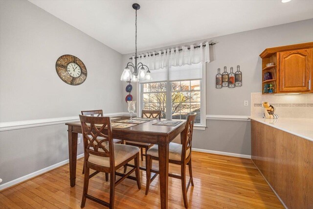 102 Shawn Cir, Staunton, VA 24401 - dining area with an inviting chandelier, light wood-style flooring, and baseboards