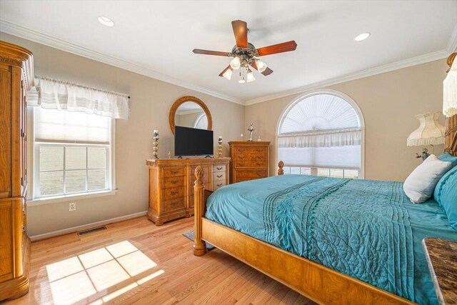 102 Shawn Cir, Staunton, VA 24401 - bedroom featuring ornamental molding, multiple windows, light wood-style floors, and visible vents