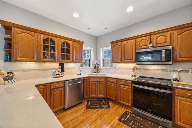 102 Shawn Cir, Staunton, VA 24401 - kitchen with a sink, stainless steel appliances, tasteful backsplash, open shelves, and light countertops