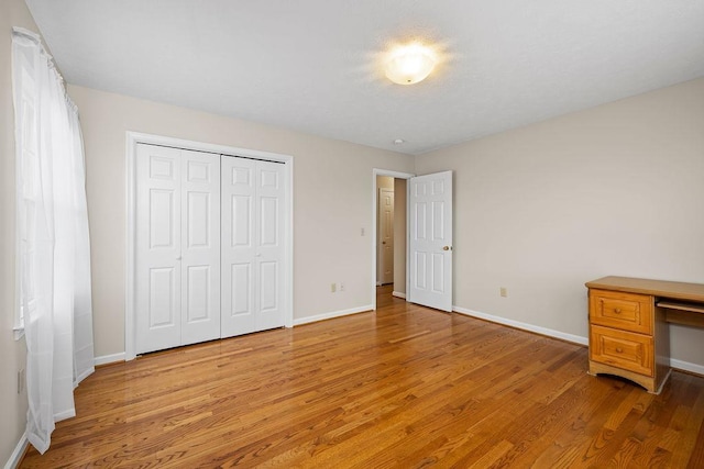 5 Granary Rd, Verona, VA 24482 - unfurnished bedroom with light wood finished floors, baseboards, and a closet