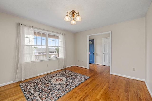 5 Granary Rd, Verona, VA 24482 - spare room with a chandelier, wood finished floors, and baseboards