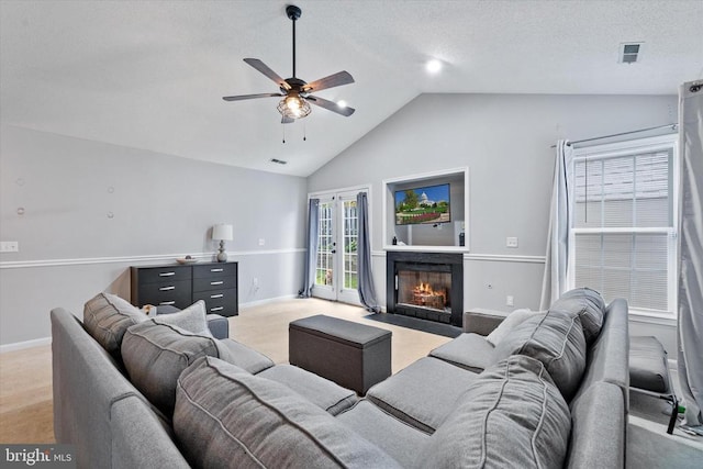 1538 Willow St, Culpeper, VA 22701 - living area with light carpet, ceiling fan, vaulted ceiling, a fireplace with flush hearth, and french doors