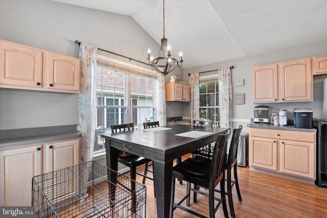 1538 Willow St, Culpeper, VA 22701 - dining area with a chandelier, vaulted ceiling, and light wood-style floors