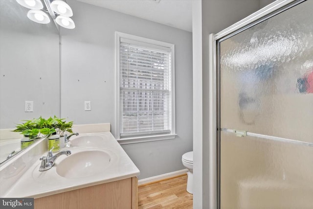 1538 Willow St, Culpeper, VA 22701 - bathroom with double vanity, a shower stall, wood finished floors, and plenty of natural light