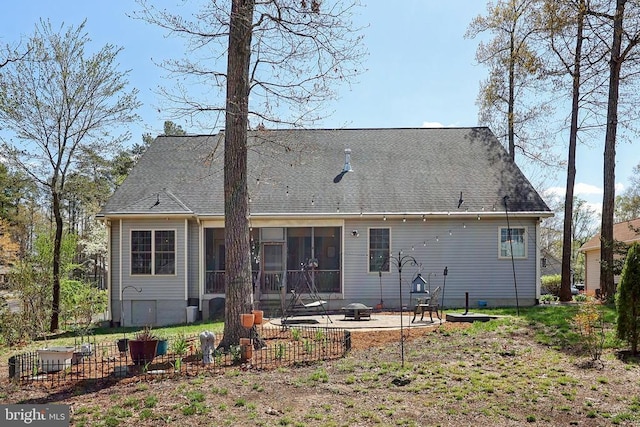 514 Lakeview Pkwy, Locust Grove, VA 22508 - rear view of property featuring a patio area, an outdoor fire pit, and a sunroom