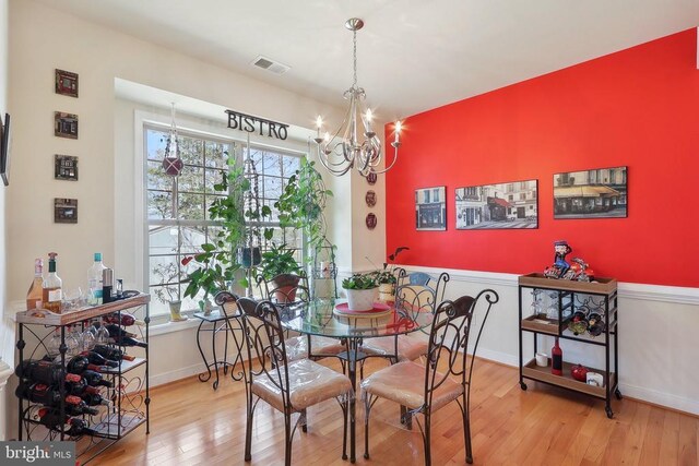 514 Lakeview Pkwy, Locust Grove, VA 22508 - dining area with hardwood / wood-style floors, a chandelier, and baseboards
