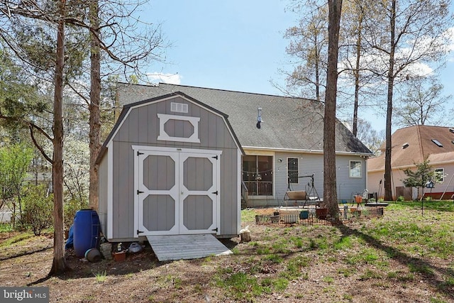 514 Lakeview Pkwy, Locust Grove, VA 22508 - back of house featuring a shed, an outdoor structure, roof with shingles, and a gambrel roof