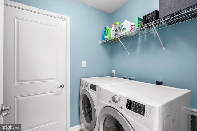clothes washing area featuring laundry area and washing machine and dryer