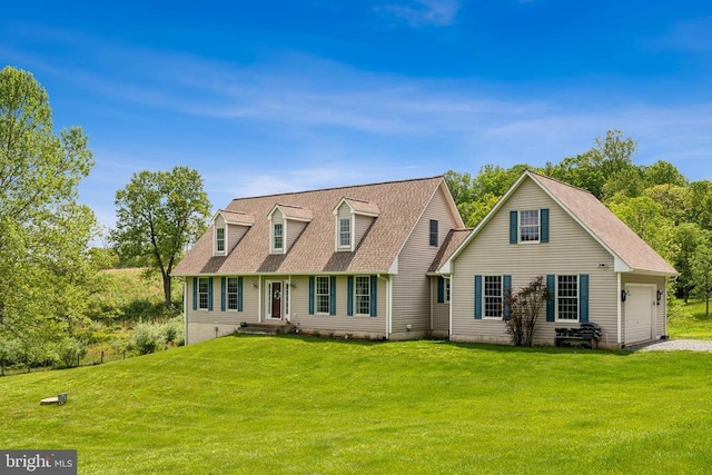 cape cod house with an attached garage, a front yard, and driveway
