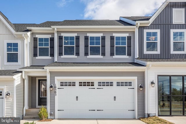 10621 Afton Grove Ct, Fredericksburg, VA 22408 - view of front of property with concrete driveway, board and batten siding, a shingled roof, and a garage