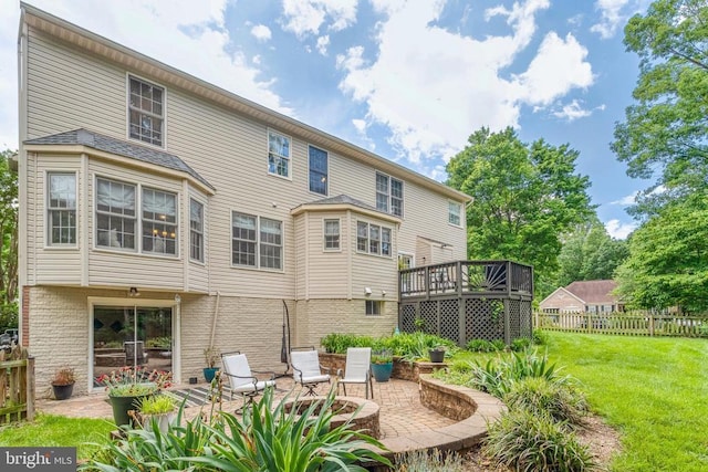 10101 Westover Ct, Fredericksburg, VA 22408 - rear view of property featuring a patio, a wooden deck, and brick siding