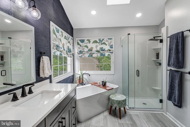 10101 Westover Ct, Fredericksburg, VA 22408 - bathroom with vanity, a shower stall, a freestanding tub, recessed lighting, and baseboards