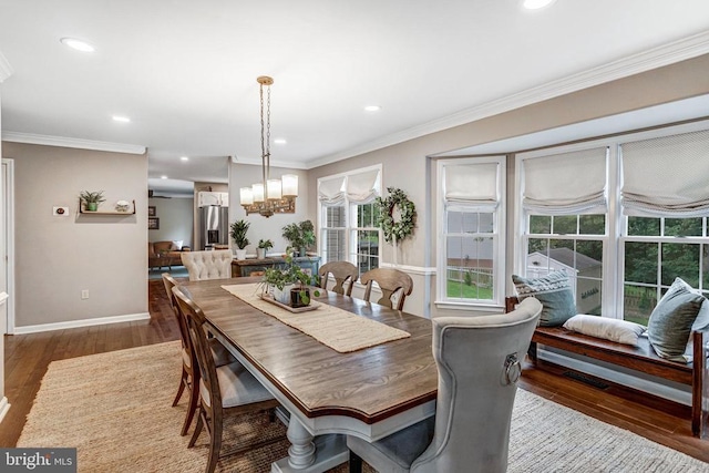 10101 Westover Ct, Fredericksburg, VA 22408 - dining area with a chandelier, wood finished floors, ornamental molding, recessed lighting, and baseboards