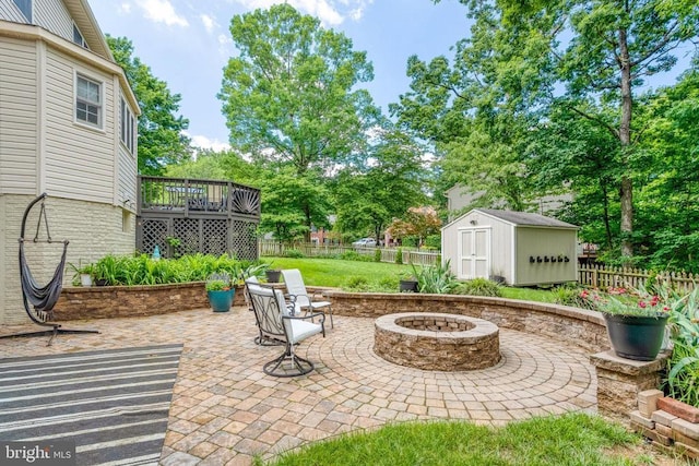 10101 Westover Ct, Fredericksburg, VA 22408 - fenced backyard with an outdoor fire pit, a patio, and a wooden deck