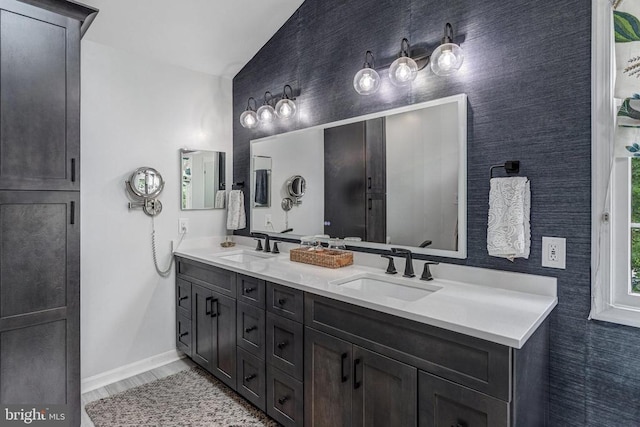 10101 Westover Ct, Fredericksburg, VA 22408 - full bath with baseboards, double vanity, and wallpapered walls