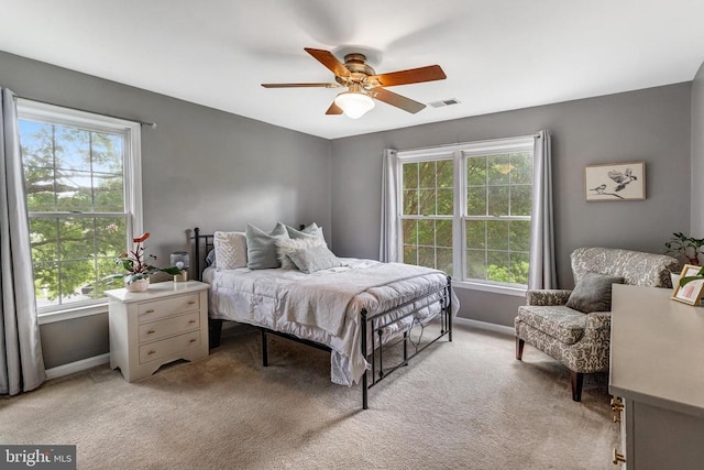 10101 Westover Ct, Fredericksburg, VA 22408 - bedroom with baseboards, light carpet, and a ceiling fan