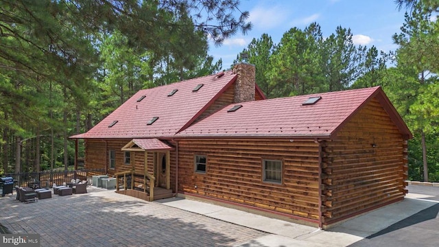 362 Dell Perkins Rd, Louisa, VA 23093 - rear view of property featuring an outdoor hangout area, log siding, a patio area, and a chimney