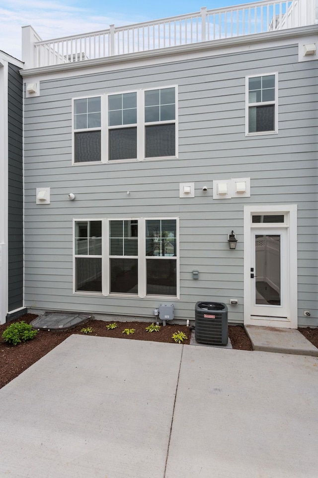 3251 Preston Shore Dr Unit 18E, Rockingham, VA 22801 - rear view of property featuring central AC and a patio area