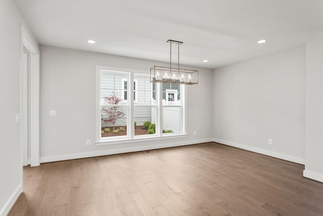 3251 Preston Shore Dr Unit 18E, Rockingham, VA 22801 - spare room with wood finished floors, a chandelier, baseboards, and recessed lighting