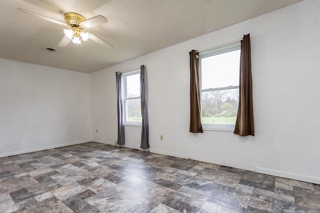 1627 Barbershop Rd, Edinburg, VA 22824 - spare room featuring baseboards, ceiling fan, and stone finish floor