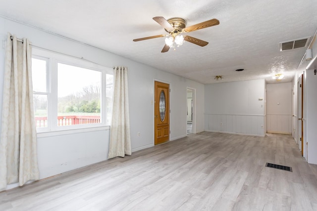1627 Barbershop Rd, Edinburg, VA 22824 - interior space with light wood finished floors, a textured ceiling, visible vents, and a ceiling fan