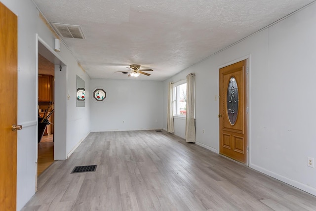 1627 Barbershop Rd, Edinburg, VA 22824 - entrance foyer with ceiling fan, a textured ceiling, and visible vents