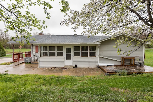 1627 Barbershop Rd, Edinburg, VA 22824 - rear view of property featuring a yard, a chimney, and a wooden deck