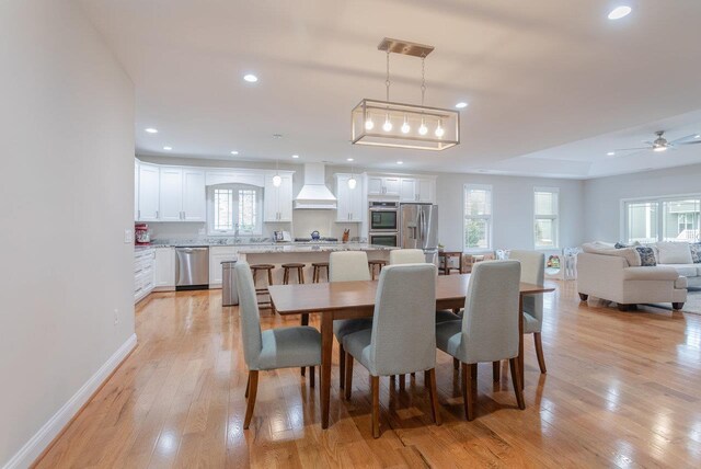 dining space featuring light hardwood / wood-style flooring