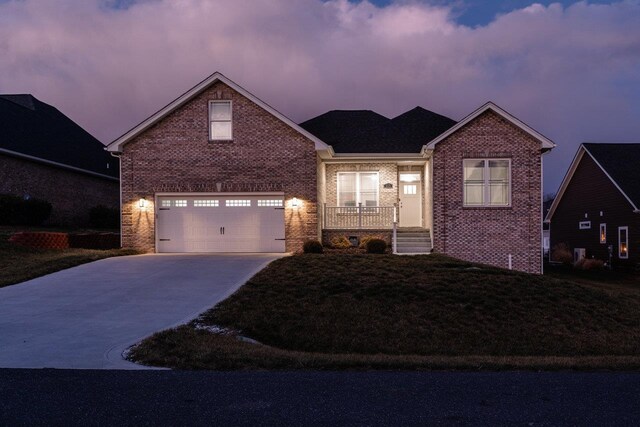 view of front of house featuring a garage and a porch