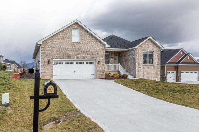 view of front of home featuring a garage and a front lawn