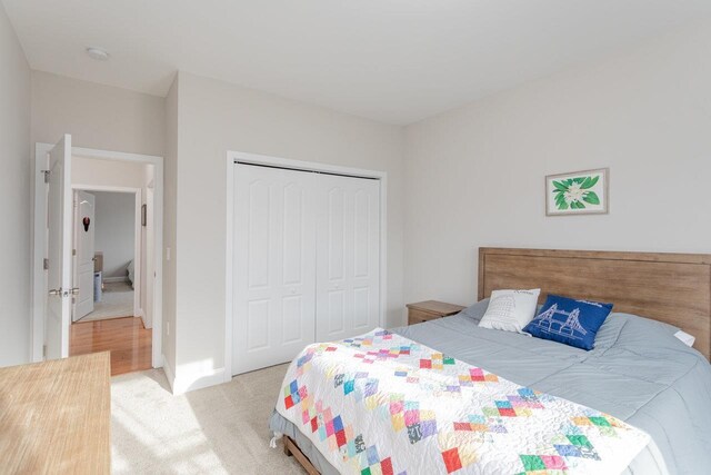 carpeted bedroom featuring a closet