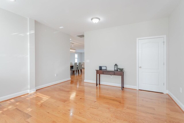 spare room featuring light hardwood / wood-style floors