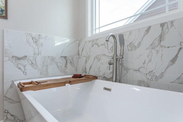 bathroom featuring a washtub