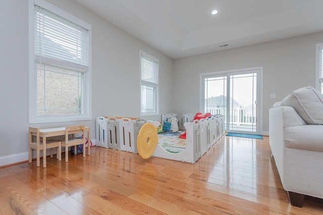 living room with light hardwood / wood-style flooring