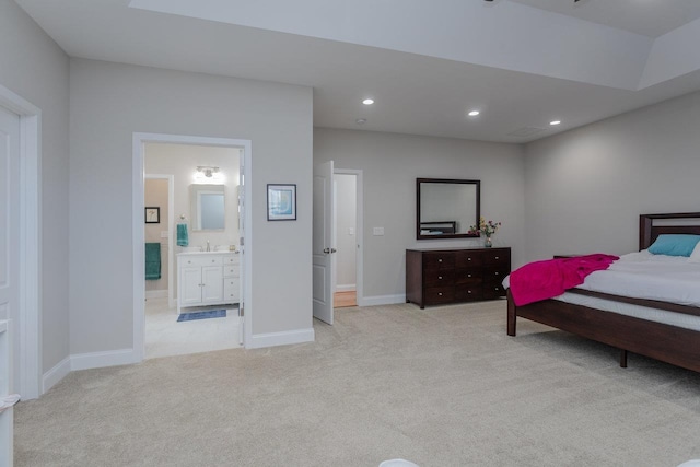 carpeted bedroom featuring connected bathroom