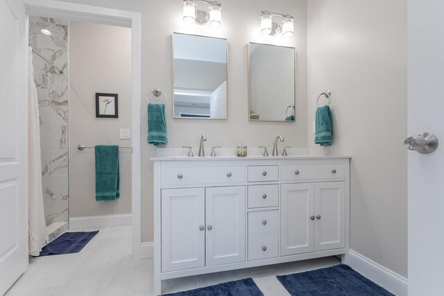 bathroom featuring vanity and a tile shower